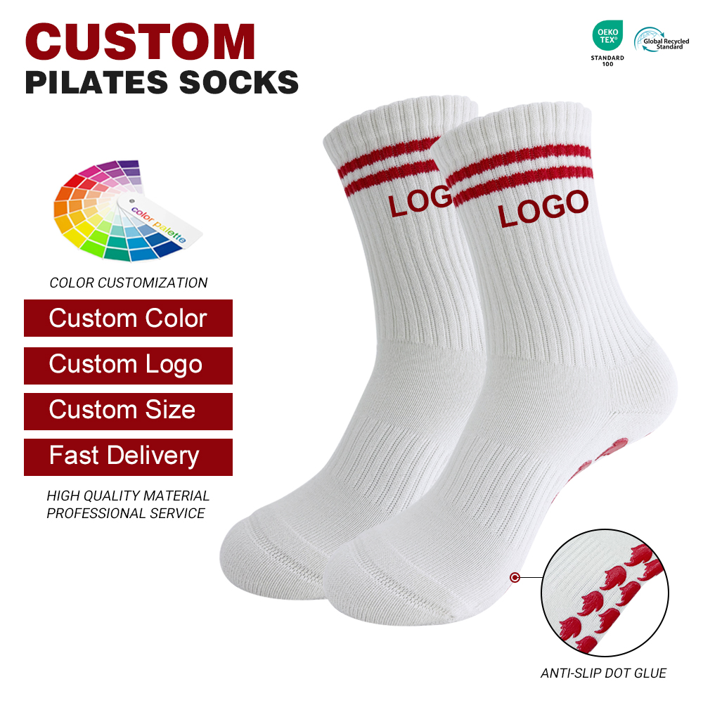 White ribbed crew Pilates grip socks with red cuff stripes and red sole grip motifs