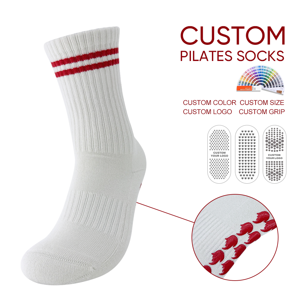 Side view of a white ribbed crew sock with two red cuff stripes