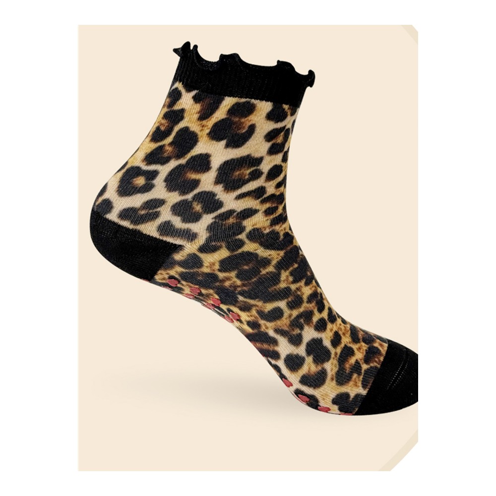 Leopard-print ankle Pilates grip sock with a black ruffle cuff and red heart-shaped sole grips