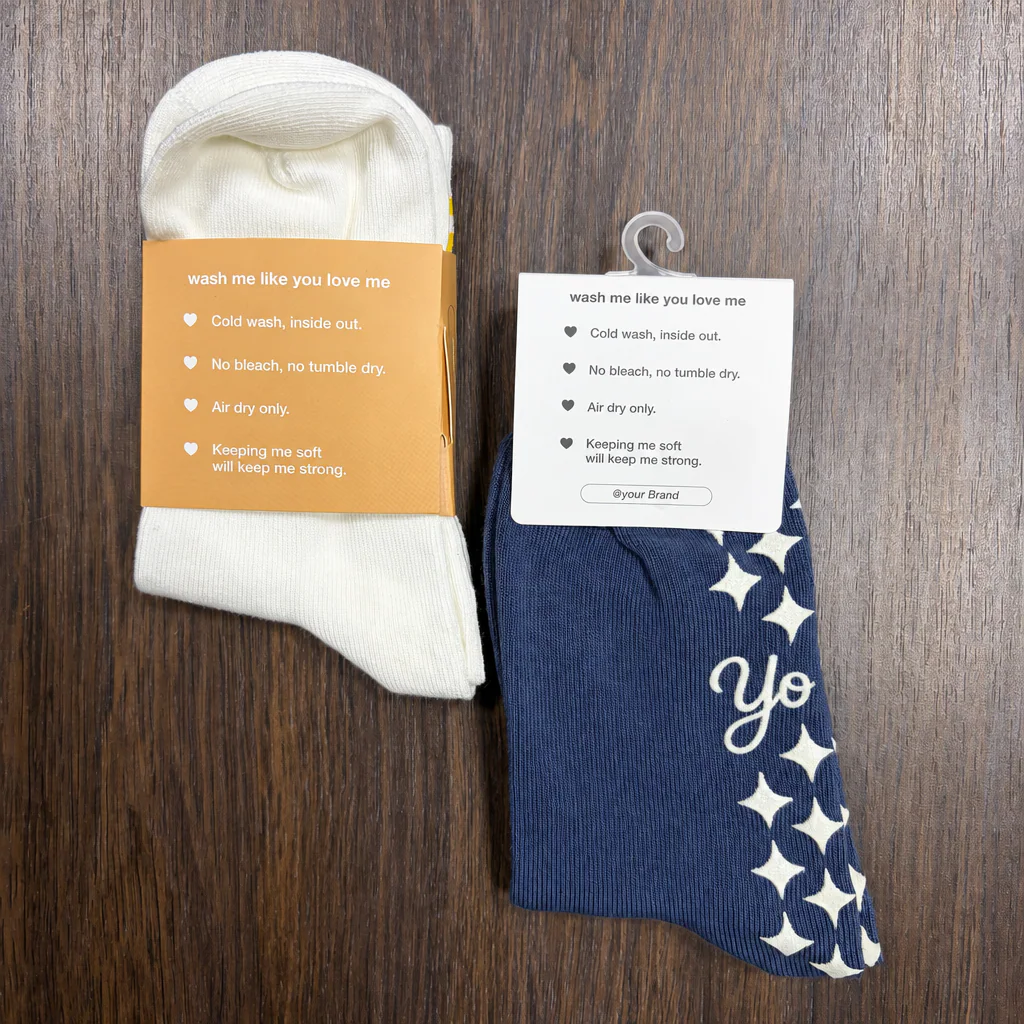 Physical paper sleeve and hanging header card packaging samples fitted to grip socks