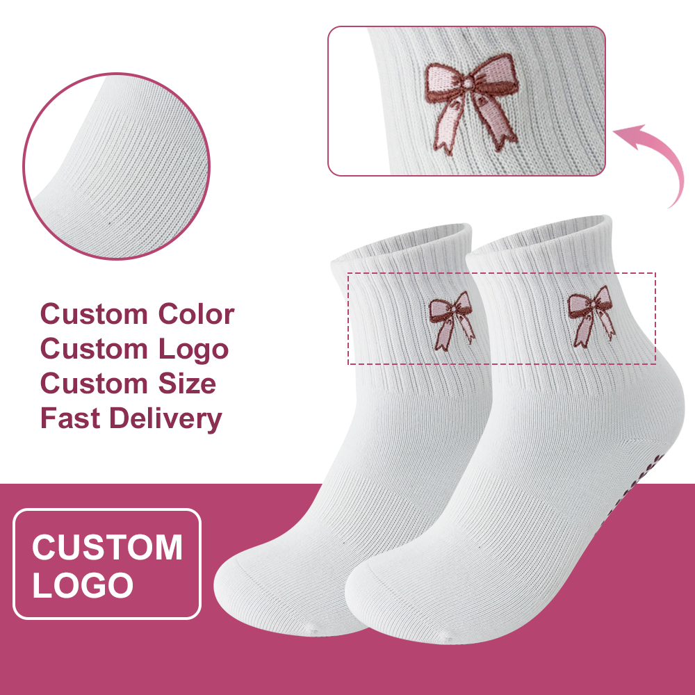 White ribbed ankle grip socks with pink bow motifs shown in the original supplied presentation