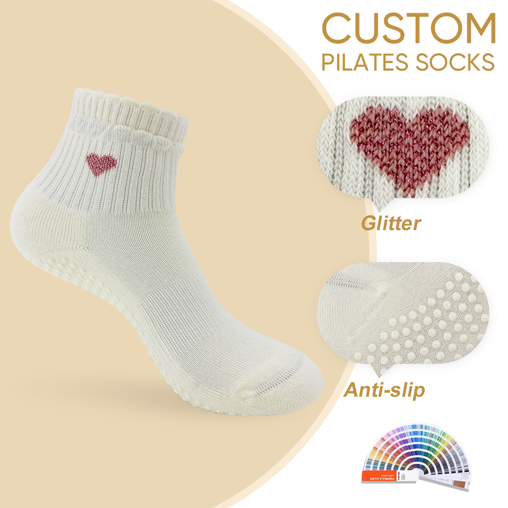 Original supplied presentation view of cream ruffle ankle grip socks with a pink glitter heart